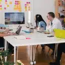 five person by table watching turned on white iMac